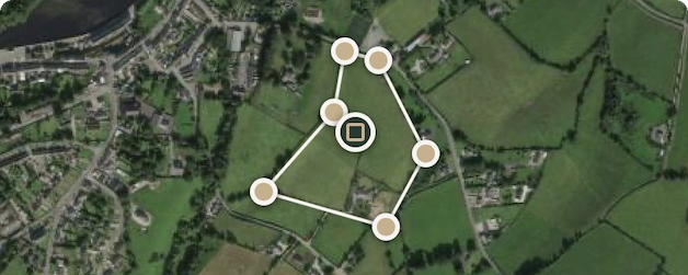 Illustrative aerial view with a boundary outline and corner markers